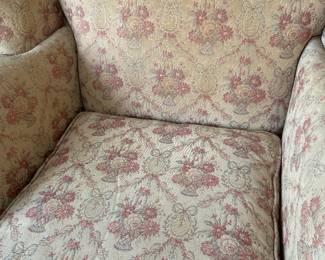 Close-up of the sweet floral fabric on the wing back chair with nailhead trim