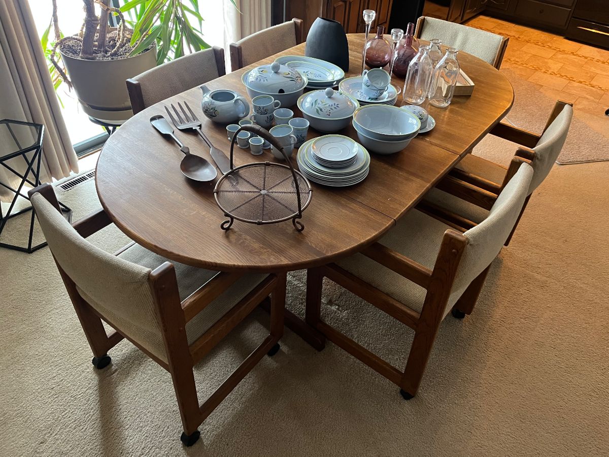Dining table with six chairs and two leaves.