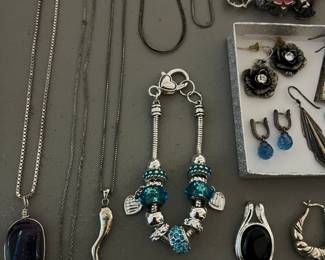 Nice selection of sterling silver jewelry, costume jewelry, and a few gold rings, chains and pendants.