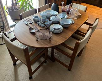 Dining table with six chairs and two leaves.