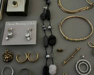 Nice selection of sterling silver jewelry, costume jewelry, and a few gold rings, chains and pendants.