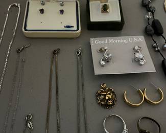 Nice selection of sterling silver jewelry, costume jewelry, and a few gold rings, chains and pendants.