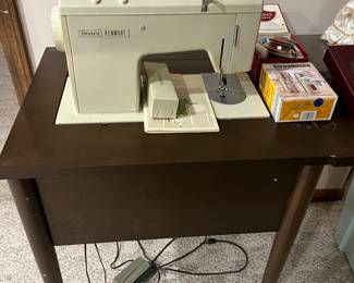 Sears Kenmore sewing machine with cabinet.