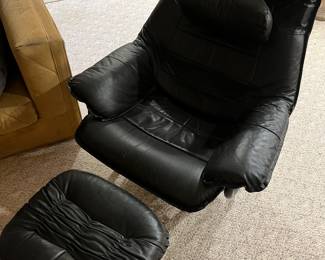 Stressless-style easy chair with ottoman.