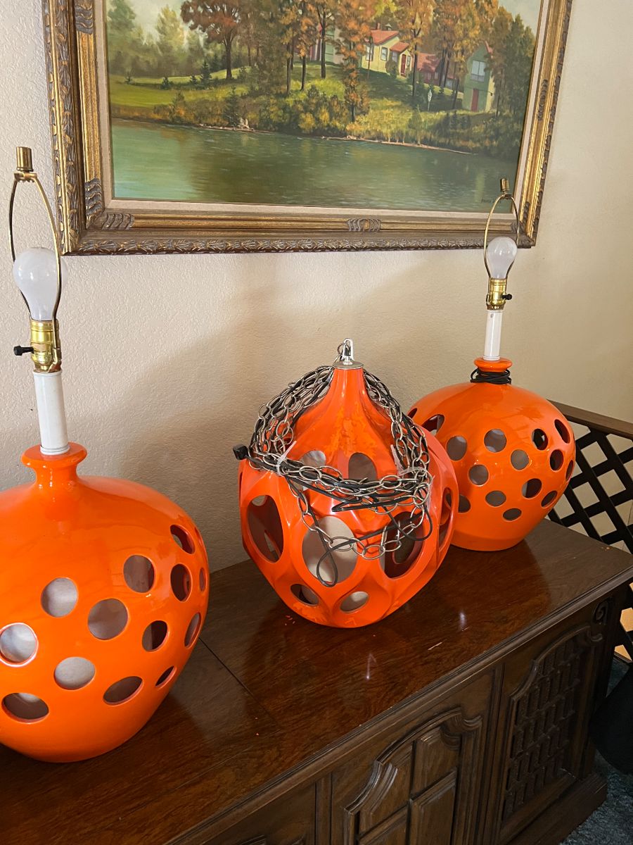 the orange is flaking off the middle lamp however underneath the flake is more orange - lamp shades are available for the two table lamps (not pictured)
