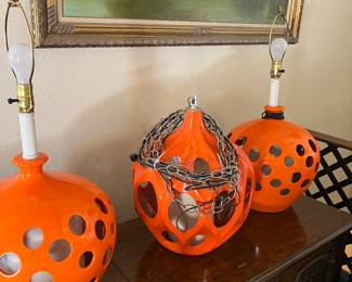 the orange is flaking off the middle lamp however underneath the flake is more orange - lamp shades are available for the two table lamps (not pictured)
