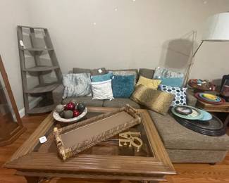 Gray Upholstered Sectional, coffee table, corner bookcase, decor