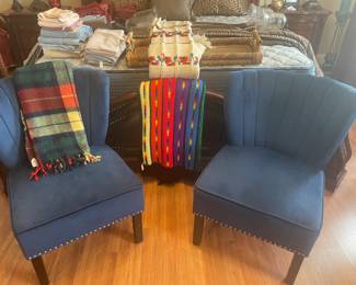 Two blue decorative chairs, linens
