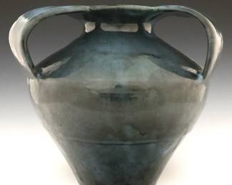 An early 20th century Pewabic Art Pottery vase.  Bulbous form with flared rim having three strap handles in mottled shades of Blue and Black.  Impressed "Pewabic Detroit" mark.  Minor wear, some crazing.  10" high.