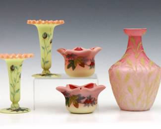 Five 19th century Victorian Period Burmese and Peachblow Glass vases.  Includes a quilted bottle form Peachblow vase with Coraline foliate decoration attributed to Mt. Washington, a pair fluted Burmese bud vases with ruffled rims and enameled floral decoration by Thomas Webb, and a pair of low Burmese vases with folded rims and enameled foliate decoration attributed to Thomas Webb.  Pair of bud vases retain original "Thos. Webb & Sons / Queen's Burmese Ware / Patented" paper labels, others are unmarked.   Minor surface wear.  Up to 6 1/2" high.   NOTE: From the estate of Bill & Barbara Shulhof of Saginaw, Michigan.