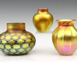 Three vintage Lundberg Studio Art Glass vases.  Bulbous forms with Iridescent Gold finish, one with Blue "Indian Blanket" decoration.  Each signed "Lundberg Studios" and dated "2000".  Minor surface wear.  Up to 5" high.   NOTE: From the estate of Bill & Barbara Shulhof of Saginaw, Michigan.
