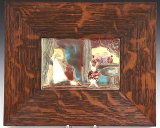 An early 20th century Pewabic Alice in Wonderland Art Pottery tile designed by Alexis Lapteff, c. 1930.  Rectangular tile decorated in relief, depicting a weeping Alice seated beside the White Rabbit, with the King and Queen of Hearts and the Cheshire Cat visible beyond an open window.  Tile incised "Pewabic" verso.  Some crazing.  Tile is 7 x 4 3/4" high, presented in a custom Quarter Sawn Oak frame by Family Woodworks, 12 1/2 x 10 1/4" high overall. 