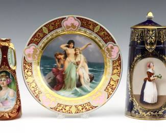 Three pieces of turn of the century Royal Vienna style porcelain.  Hand-painted scenes with Gilded detail, includes a "Sirens" cabinet plate, a chocolate pot with a portrait of a woman serving drinks, and a handled vase with a portrait of a young woman with flowers in her hair.  Various Beehive marks, plate also with printed "Dresden" and Lamb mark.  Minor wear to decoration, vase with slight crazing.  Plate is 9 1/2" diameter, vessels up to  10" high.   NOTE: From the estate of Bill & Barbara Shulhof of Saginaw, Michigan.