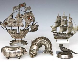 Five 19th to 20th century Silver miniature figures.  Includes a Portuguese Sterling filigree figure of a ship with enameled flags, a Continental .800 Silver figure of a ship, a Continental .800 Silver fish form shaker, an English Sterling pig form box, and an English Sterling pheasant place card holder with weighted bottom.  Ships unmarked, tested Sterling and .800 Silver, fish marked "800", pig and pheasant with English hallmarks.  4.10 troy ozs total without weighted place card holder.  Some surface wear, filigree ship with minor distortion.  Up to 3 1/2" high.   NOTE: From the estate of Bill & Barbara Shulhof of Saginaw, Michigan.