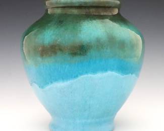 An early 20th century Pewabic Art Pottery vase.  Bulbous footed form with drip glaze in mottled shades of Turquoise Blue and Green.  Impressed "Pewabic Detroit" mark.  Minor wear, crazing.  7" high. 