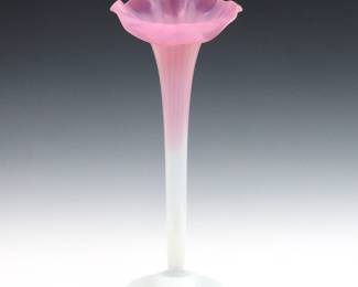 A 19th century late Victorian Period Jack-in-the-Pulpit Art Glass vase.  Cranberry and Opalescent glass vase with tall floral form and fluted body.  Unsigned.  Minor surface wear.  18" high.   NOTE: From the estate of Bill & Barbara Shulhof of Saginaw, Michigan.