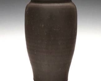 A 20th century Pewabic Art Pottery vase.  Tapered cylindrical form with matte Brown glaze.  Impressed "Pewabic Detroit" mark.  Minor surface wear.  7 3/4" high. 