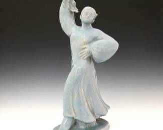 An early 20th century Alexis Lapteff for Pewabic Pottery figure.  Depicts a woman folk dancing with handkerchief in a mottled Blue glaze.  Signed "A. Lapteff" at base, labeled "Pewabic" at underside.  Chip to end of handkerchief, some chips to base and painted touch-ups, crazing.  16" high. 