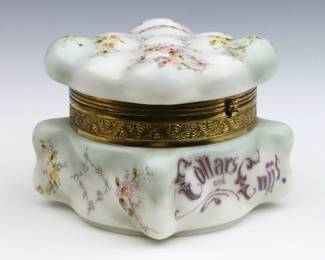 A late 19th century Wavecrest "Collars and Cuffs" Art Glass dresser box.  Square molded "egg crate" body with hinged lid, Gilded metal mount and enameled floral decoration on a Ivory White ground.  Unmarked.  Some wear to surface and decoration, lacks satin lining.  7 x 6 1/2 x 6" high overall.   NOTE: From the estate of Bill & Barbara Shulhof of Saginaw, Michigan.