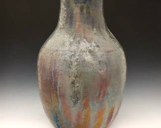 A large early 20th century Pewabic Art Pottery vase.  Baluster form with ribbed linear texture and mottled lava glaze in shades of Iridescent Grey, Blue and Pale Purple.  Impressed "Pewabic Detroit" mark, also retains original "Pewabic Detroit" medallion paper label at underside.  Minor wear, slight crazing.  18 1/4" high.