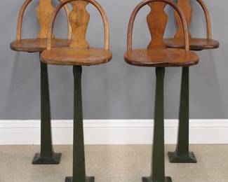 Four early 20th century Soda Fountian stools by the Milwaukee Chair Company for the Northwestern Furniture Company, Milwaukee, WI.  Cast iron floor mount bases with Green porcelain finish with revolving Oak seats and backs.  Minor wear, two with Brass nameplates.  Each 42 1/2" high. 