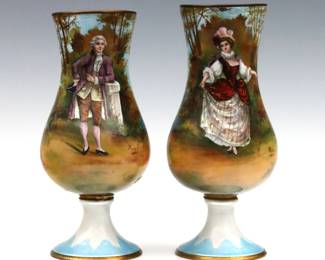 A pair of 19th century French enameled Copper portrait vases.  Baluster form with hand-enameled scenic decoration depicting a gentleman and lady standing before forested landscape with a lake.  Signed by the artist "Roy".  Vase with the gentleman has a 1/4" area of damage to enamel, some surface wear and minor denting.  Up to 8" high.   NOTE: From the estate of Bill & Barbara Shulhof of Saginaw, Michigan.