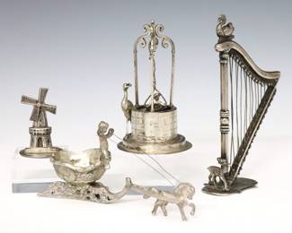 Four 19th to 20th century Continental .800 Silver miniature figures.  Includes a German figure of a baby in the bucket of a well with a stork, a horse drawn chariot driven by a Putti, a harp with figures of a swan and deer, and an articulated Dutch figure of a windmill.  Well, chariot and windmill marked "800", harp with illegible mark but tested .800 Silver or higher.  4.46 troy ozs total.  Some surface wear, Silver wires with some kinks.  Up to 4" high.  NOTE: From the estate of Bill & Barbara Shulhof of Saginaw, Michigan.
