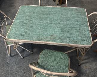 So this is an original 1950’s aluminum child’s table with 4 chairs in almost pristine condition 