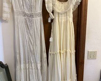 The one on the left is probably a 1920s wedding dress and the other one is from the 1950s original gunne sax by Melissa of San Francisco 