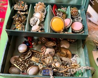 Lots of vintage costume jewelry, cufflinks, brooches, bracelets, and so much more!