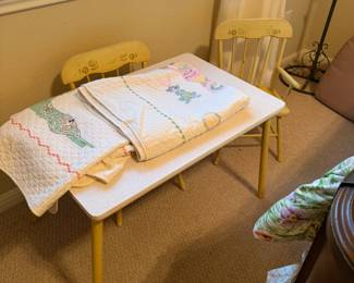 Vintage children's table & chairs and handmade cross-stitched blankets