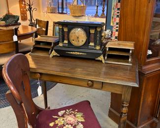 Nice writing desk with cubbies.   Neddle point chair. Beautiful mantel clock