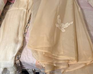 Vintage Train of wedding dress.  On left side vintage curtain panels