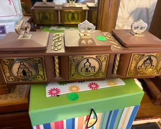 Music box in middles of attached trinket boxes.