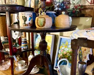 Two tier side table, pottery jars, pink Depression glass, oil
Paintings, vintage mugs