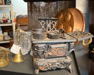 Cresent Cast iron toy stove with accessories , copper and brass