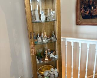 Beautiful gold leaf curio cabine w light. Belonged to owners grandparents.