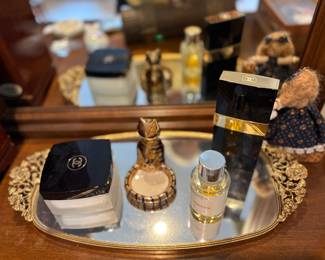 Vanity Mirror. Channel cream and perfume. Notice the cat ring holder