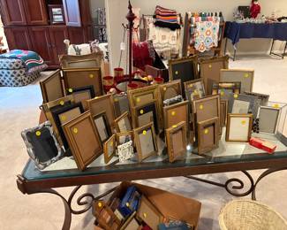Frames of all kinds and sizes. Notice large Iron glass top table - beautiful and it is heavy!