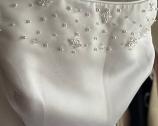 BEADED DETAILING ON PALLAS ATHENA WEDDING DRESS. NEVER WORN. NEVER ALTERED.