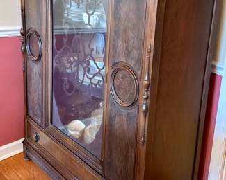 Antique Oak China Cabinet with Scrolled Glass and Carved Details