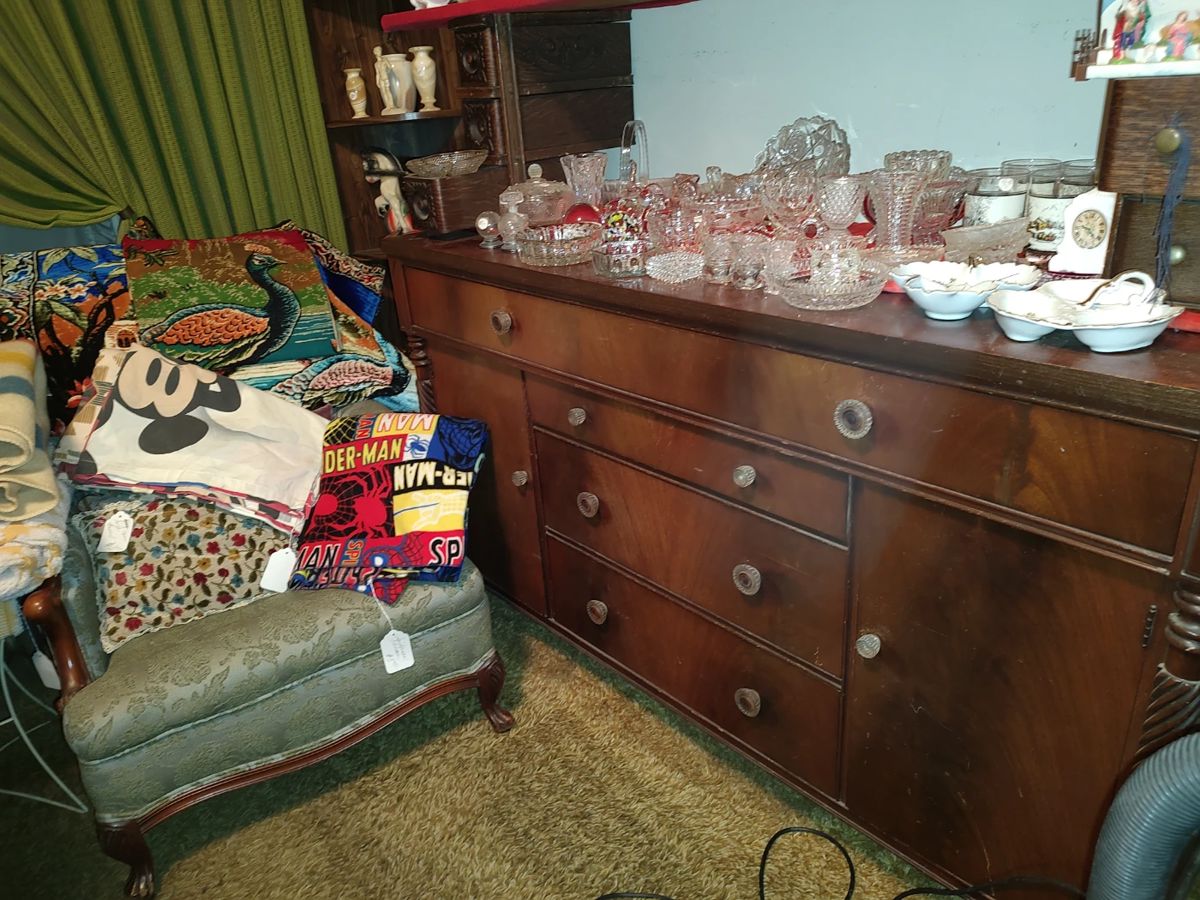 Mahogany buffet, Upholstered chair and blankets and tapestries!