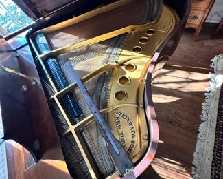 Steinway baby grand piano in walnut. Has not been serviced for several decades. Dimensions are 61"L (not including keyboard with adds 6")  x 57"L x 38"H. Entertaining offers and happy to meet on site to inspect the item.