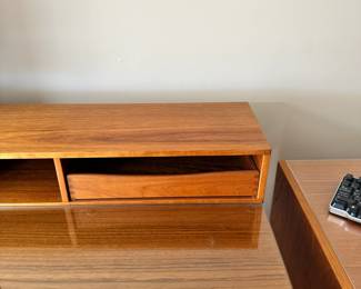 ALTERNATE VIEW: Lovig Mid Century Teak Desk. In good condition with normal wear. Top has been protected with fitted glass. Measurements: 64"W x 28 1/2"D x 29"H. AVAILABLE FOR: $2100