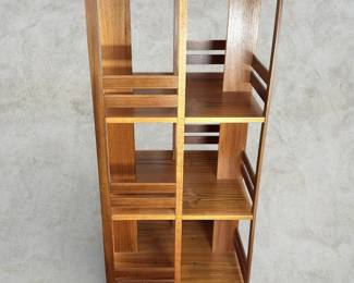 Mid Century Modern Danish Teak Revolving Bookcase. (Condition: Piece of veneer missing from rotating base - see photos). Measurements: 45 1/2"H x 19 3/4"W x 19 3/4"D. AVAILABLE FOR: $350