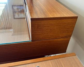 ALTERNATE VIEW: Lovig Mid Century Teak Desk. In good condition with normal wear. Top has been protected with fitted glass. Measurements: 64"W x 28 1/2"D x 29"H. AVAILABLE FOR: $2100