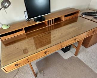 ALTERNATE VIEW: Lovig Mid Century Teak Desk. In good condition with normal wear. Top has been protected with fitted glass. Measurements: 64"W x 28 1/2"D x 29"H. AVAILABLE FOR: $2100