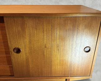 ALTERNATE VIEW: Teak Sideboard (Condition: bottom drawer needs adjustment to close completely. There is a vertical hairline separation on the right side of the sliding panel). Measurements: 32"H x 47 1/2"L x 18 1/2"D. AVAILABLE FOR: $800