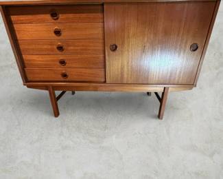 ALTERNATE VIEW: Teak Sideboard (Condition: bottom drawer needs adjustment to close completely. There is a vertical hairline separation on the right side of the sliding panel). Measurements: 32"H x 47 1/2"L x 18 1/2"D. AVAILABLE FOR: $800