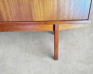 ALTERNATE VIEW: Teak Sideboard (Condition: bottom drawer needs adjustment to close completely. There is a vertical hairline separation on the right side of the sliding panel). Measurements: 32"H x 47 1/2"L x 18 1/2"D. AVAILABLE FOR: $800